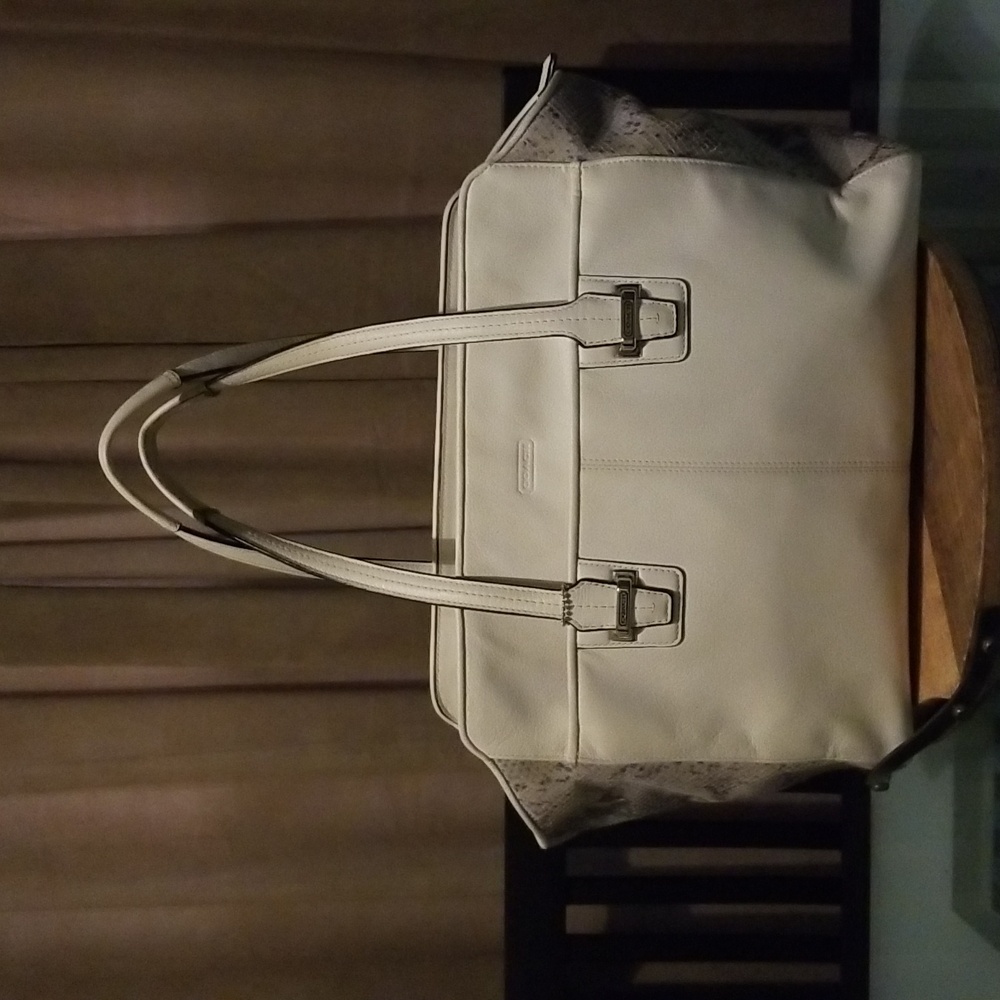 Coach White Leather handbag with snake skin accent on sides.